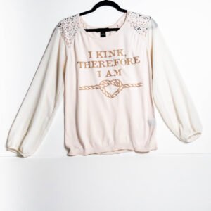 Cream colored long sleeve shirt. Sleeves are transparent, Lace shoulder details