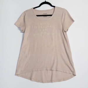 Cream relaxed bell fit, rounded hem, cap sleeve shirt.