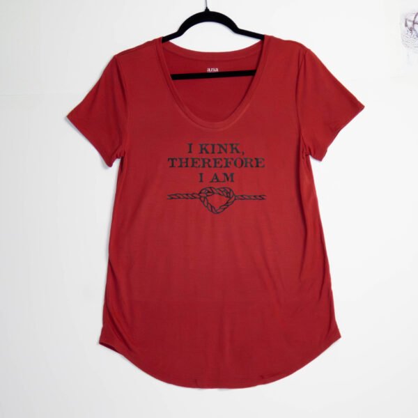 Red t-shirt with black writing. relaxed, rounded bottom hem.